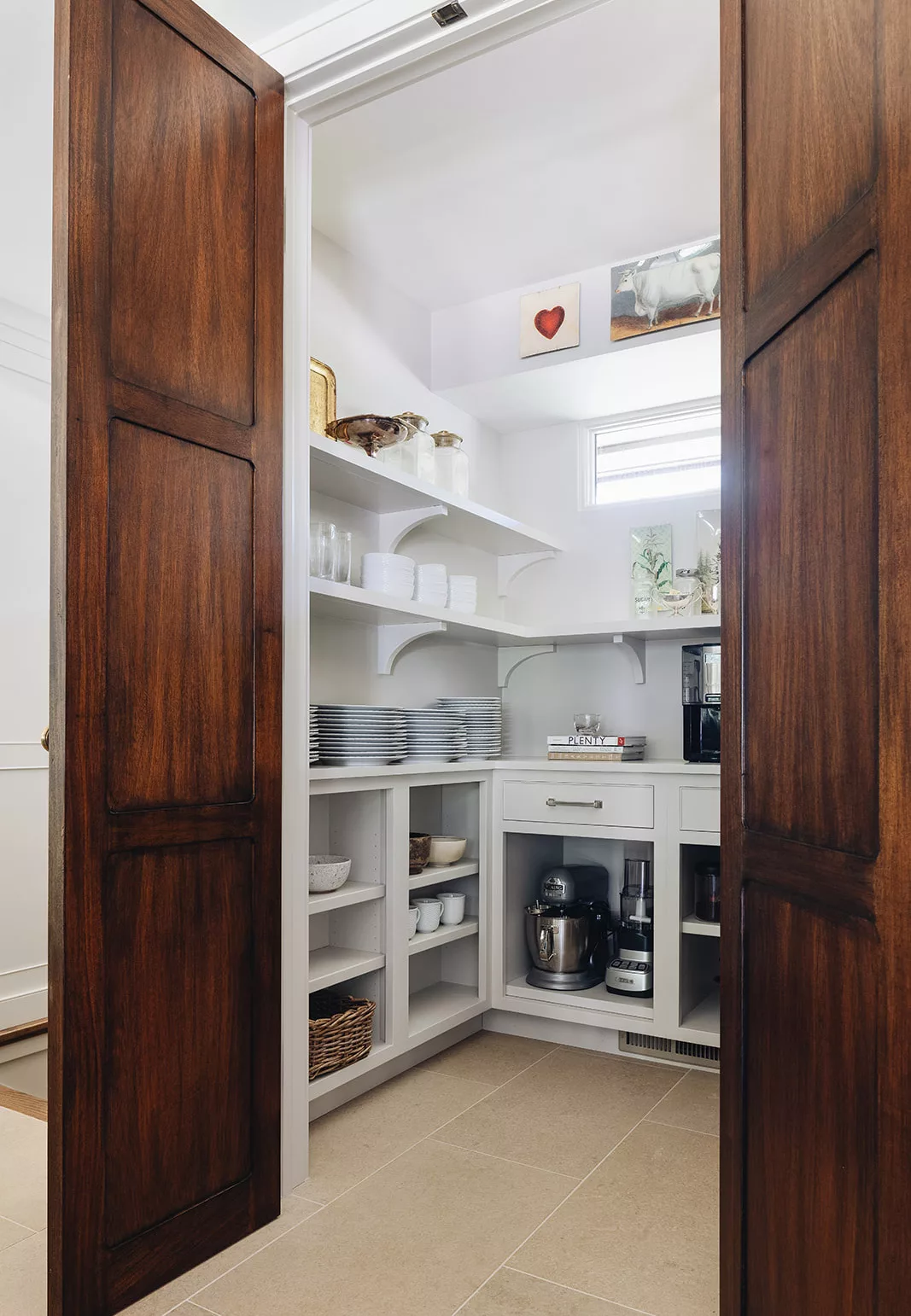 Pantry with custom shelving and cabinets