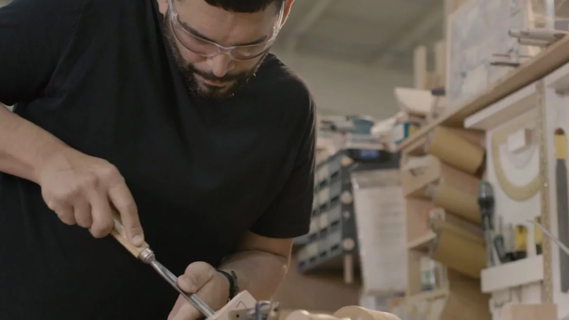Craftsperson working to create custom cabinets
