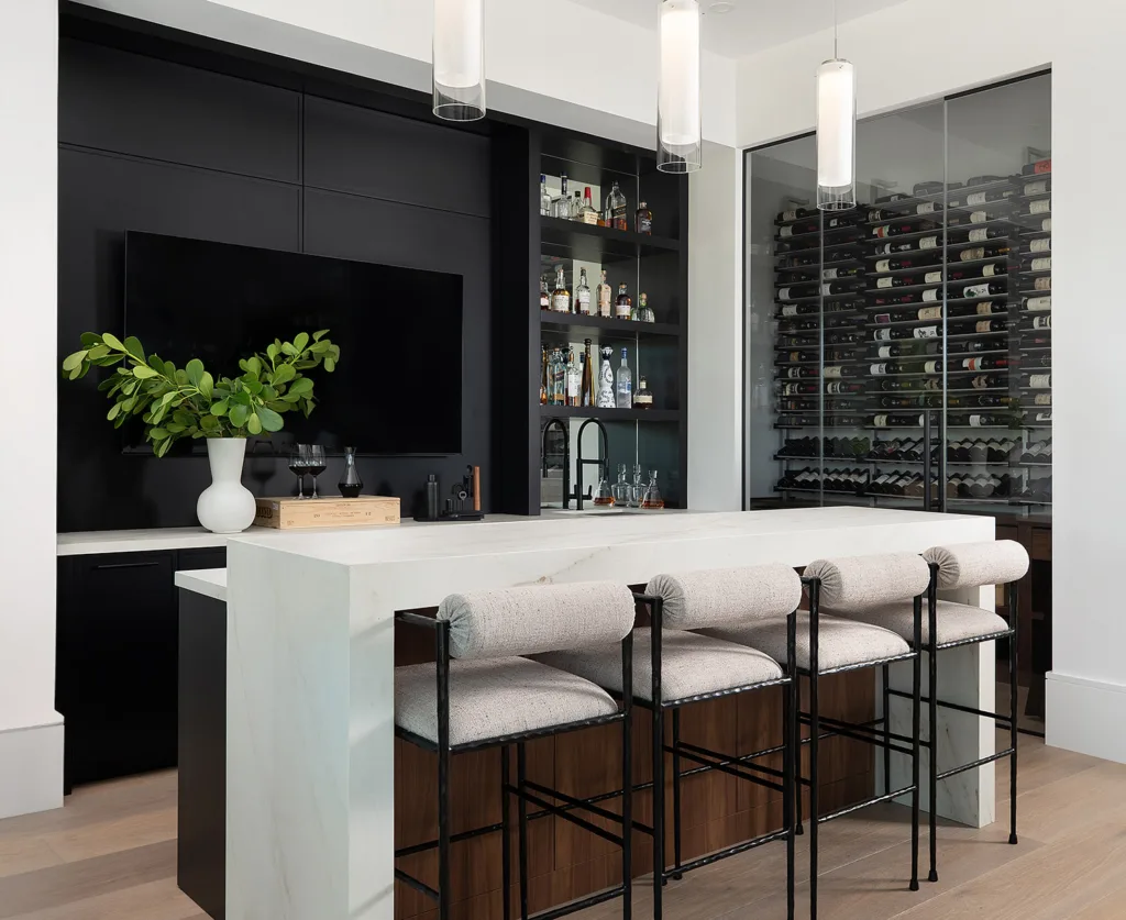 Island with stools and custom wine storage cabinets