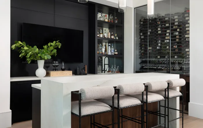 Island with stools and custom wine storage cabinets