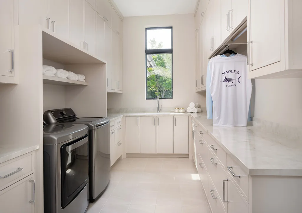 Custom laundry cabinets with a washer and dryer