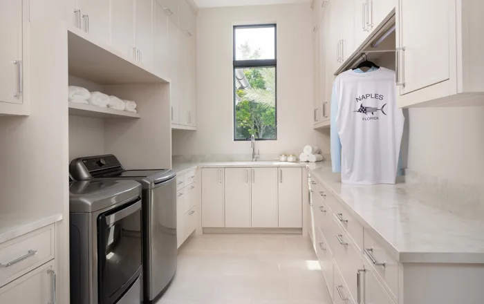 Custom laundry cabinets with a washer and dryer