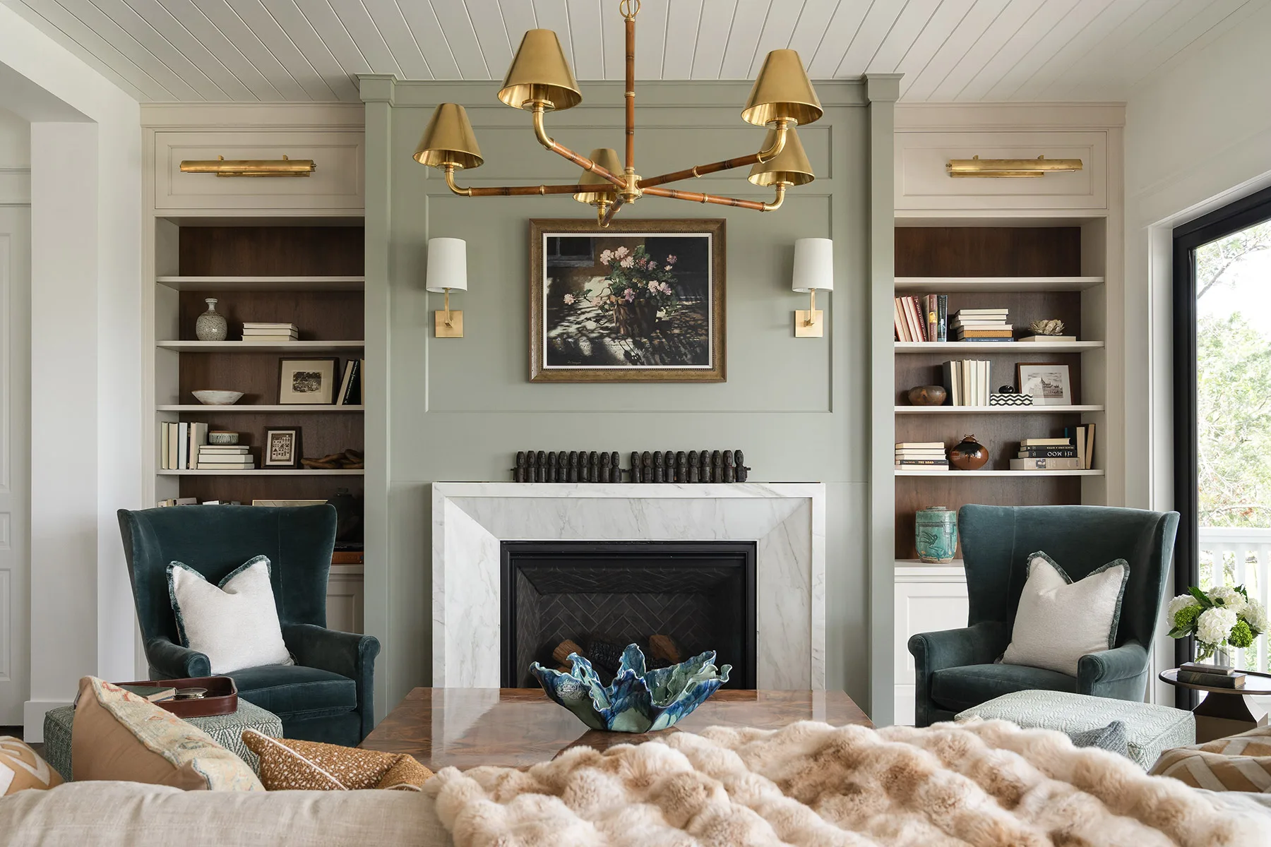 Living room with built in cabinets and fireplace